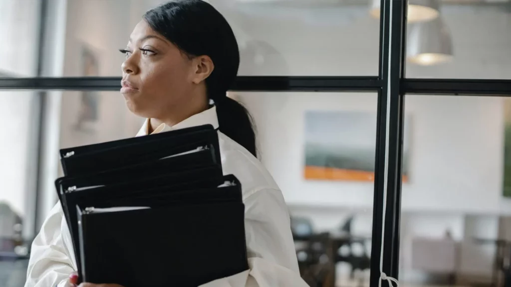 woman carrying folders