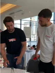 Ryan explaining to colleague